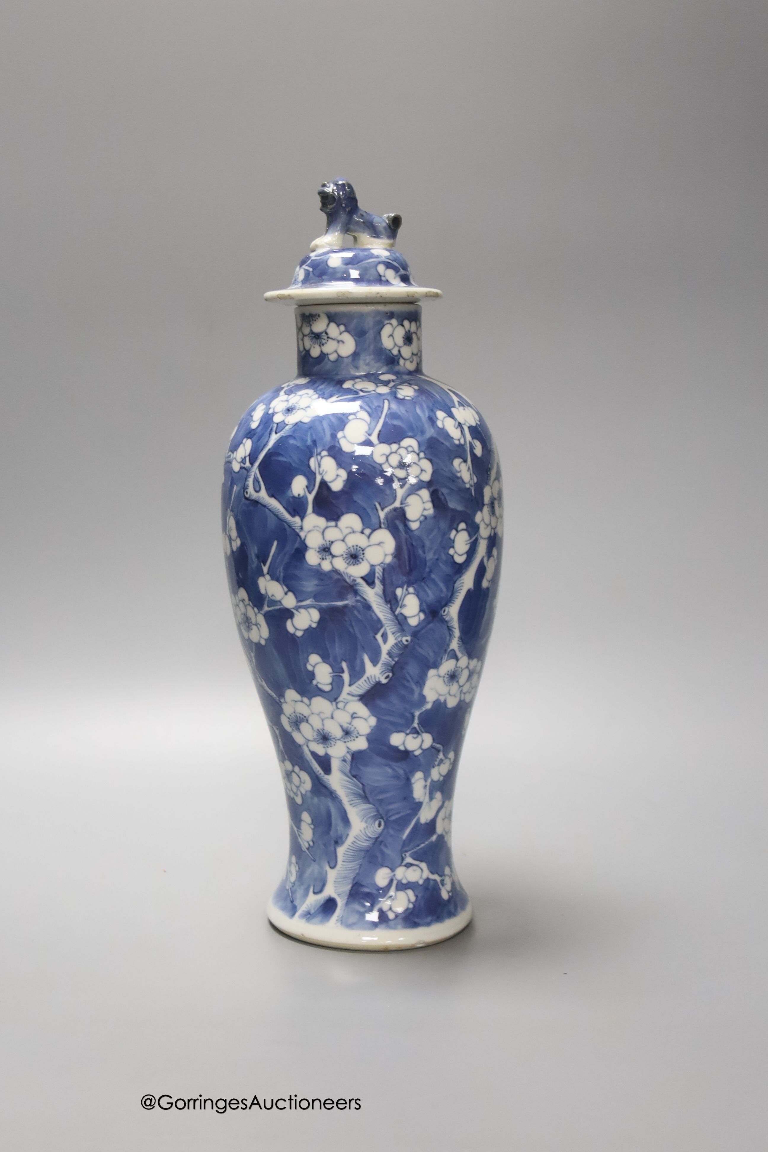 A 19th century Chinese blue and white 'prunus' vase and cover, height 33cm